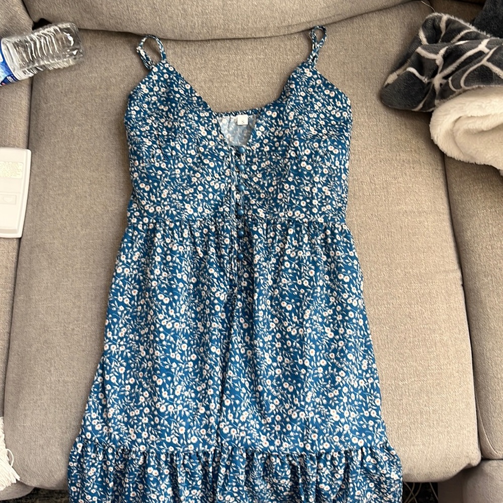 mini sundress, v neck cut, buttons down the middle on the top half